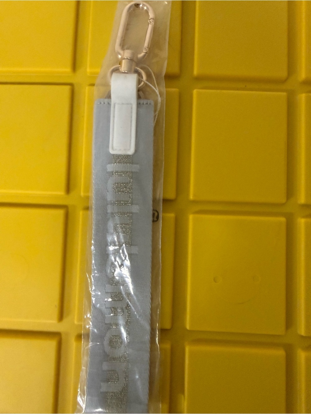 lululemon athletica keychain with gold hardware